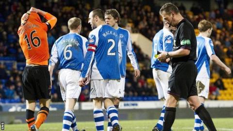 Dundee United midfielder Stuart Armstrong is send off by referee Iain Brines