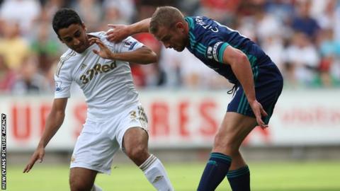 Neil Taylor (left) in action against Sunderland's Lee Cattermole