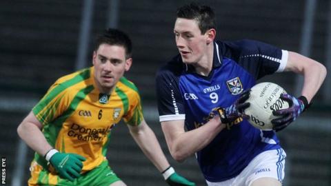 Cavan's Michael Argue tries to burst away from Donegal's Martin O'Reilly