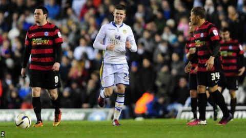 Sam Byram (centre) in action for Leeds United