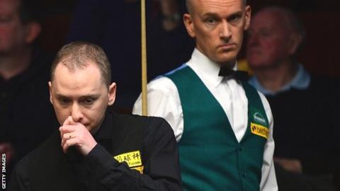 Graeme Dott (left) eyes up a shot as Peter Ebdon looks on from behind