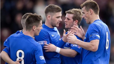 Rangers players celebrate after their fourth goal