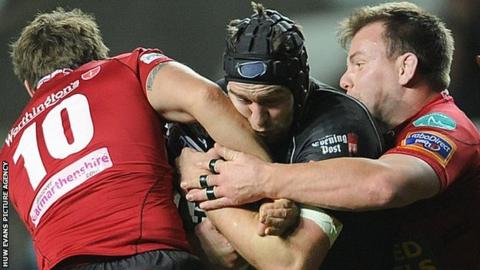 Ospreys back row Ryan Jones takes on the Scarlets defence