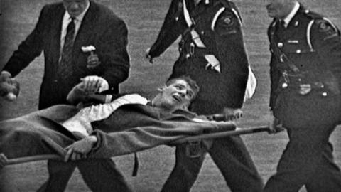 Dave Whelan being stretchered off in the 1960 FA Cup final