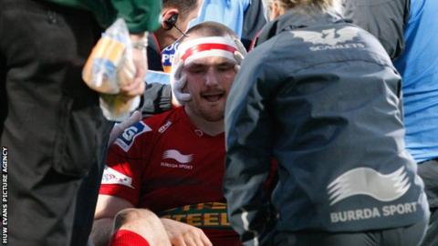 Ken Owens is treated on the pitch at Ravenhill
