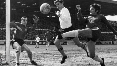 Bobby Tambling, right, turns a shot goalwards