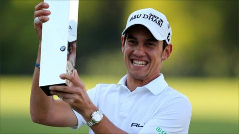 Matteo Manassero of Italy celebrates with the trophy