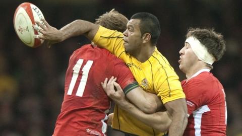 Australia's Kurtley Beale passes against Wales in November, 2012