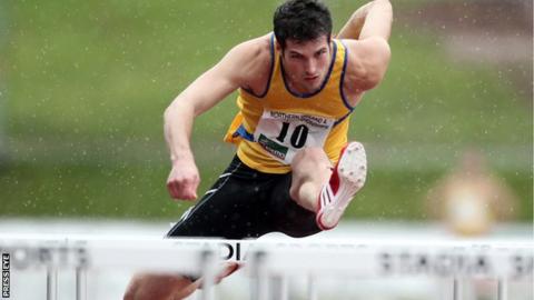Ben Reynolds on his way to winning the 110m hurdles