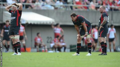Wales forwards Andrew Coombs, Andries Pretorius and Craig Mitchell look dejected at the end of the game