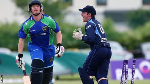 Leinster's Fintan McAllister celebrates after stumping Andrew Riddles of North West Warriors