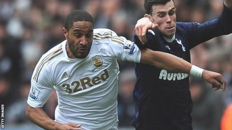 Swansea's Ashley Williams takes on Gareth Bale of Tottenham Hotspur