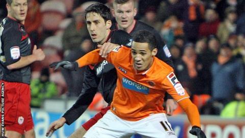 Tom Ince takes on Cardiff City's Peter Whittingham in January, 2013