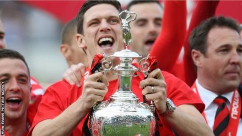 Mark Hudson celebrates Cardiff's promotion to the Premier League