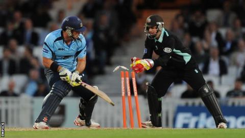 Michael Yardy (l) is stumped by Steven Davies