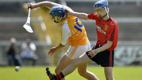 Antrim's Jordan Doran is challenged by Down opponent Cormac MacAllister in last month's Ulster final