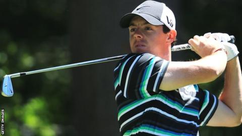 McIlroy watches a shot during the third round