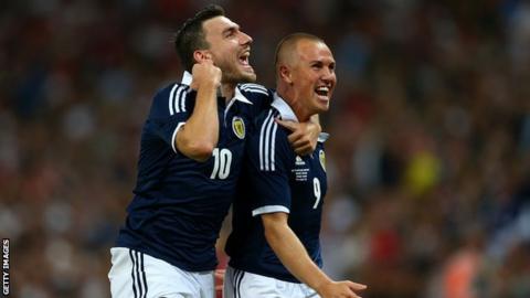 Robert Snodgras and Kenny Miller celebrate