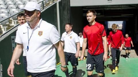 Viktor Kumykov leads his team out for a practice session at the Astana Arena