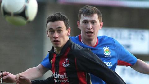 Paul Healey of Crusaders and Linfield's Billy Joe Burns