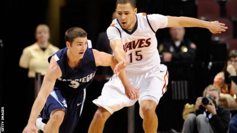 Devin Ginty (left) tries to spin clear