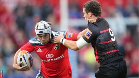 Munster's Duncan Williams attempts to get past Sean Kennedy of Edinburgh