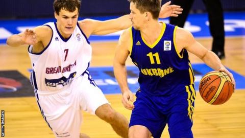 Ukraine's Dmytro Zabirchenko with Great Britain's Devon Van Oostrum