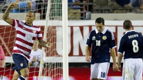 Jermain Jones celebrates scoring against Scotland