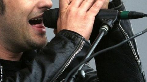 US band Black Rebel Motorcycle Club singer Peter Hayes performs during a concert at the Rock en Seine music festival on August 24, 2013