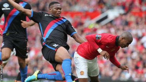 Kagisho Dikgacoi tackles Manchester United's Ashley Young