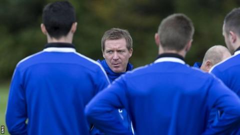 Hearts manager Gary Locke oversees his players in training