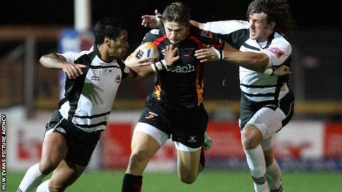 Dragons centre Hallam Amos takes on the Zebre defence