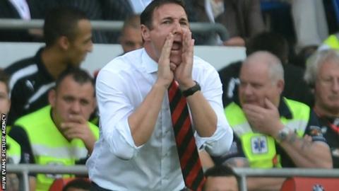 Malky Mackay on the touchlines