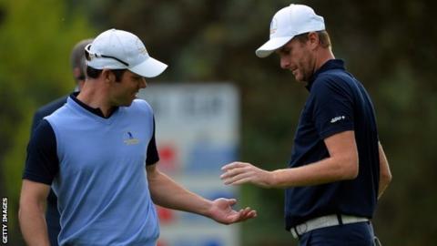 Paul Casey (left) and David Lynn of Great Britain and Ireland draw their side level