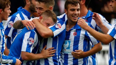 Hartlepool United players celebrate a goal against Accrington