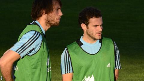 Michu (left) with Juan Mata