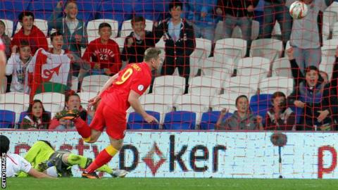 Simon Church scores the second half winner against Macedonia in Cardiff