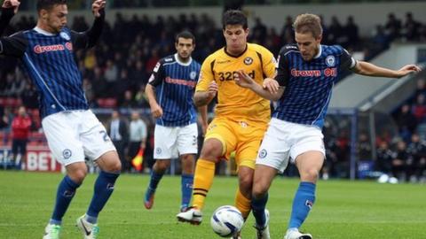 Newport’s Danny Crow is outnumbered by the Rochdale defence