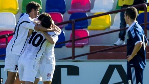Georgia celebrate Valeri Kazaishvili's goal