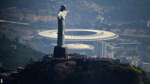 The iconic Christ the Redeemer statue in Rio with the Maracana below