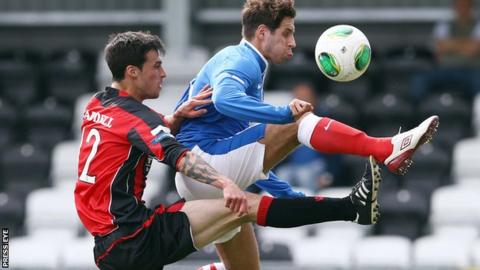 Crusaders midfielder Declan Caddell challenges Sean ward of Linfield