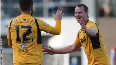 Robbie Willmott and Michael Flynn celebrate Newport's third goal