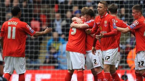 Crewe players celebrate a goal at Wembley, April 2013
