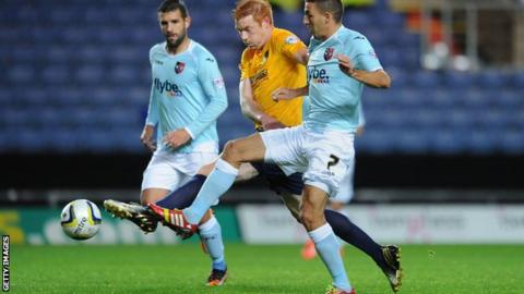 Dave Kitson and Liam Sercombe battle for possession