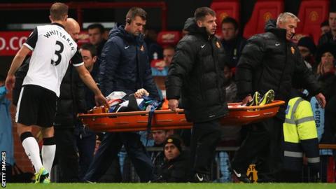 Robert Snodgrass is carried from the pitch on a stretcher