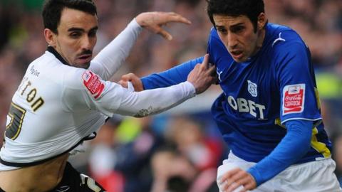 Leon Britton and Peter Whittingham tangle during the last match between Cardiff and Swansea
