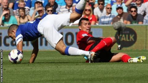 Cardiff's Gary Medel brings down Leon Osman of Everton