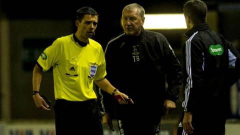 Referee Kevin Clancy and Inverness manager Terry Butcher