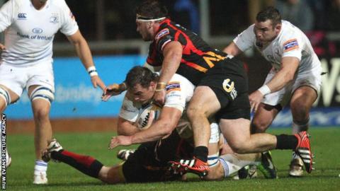 Leinster back-row Rhys Ruddock takes on the Dragons defence