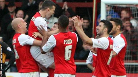 Steve Schumacher celebrates with his team-mates